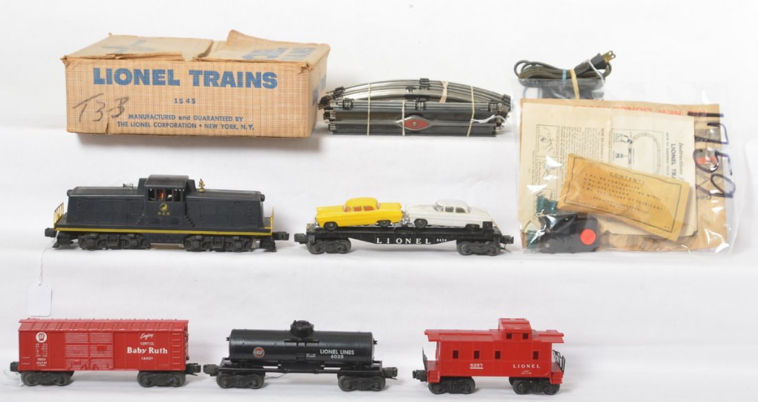 Lionel boxed 1545 w/628, 6025, 6424, 6014, 6257: Postwar Lionel O gauge boxed 1545 diesel freight set with 628 Northern GE 44 ton diesel switcher, 6025 Gulf tank car, 6424 auto flat w/correct length original autos, X6014 PRR Baby Ruth boxcar, and 62