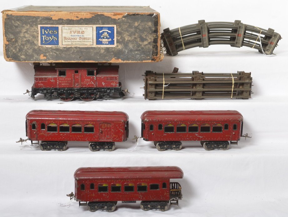 Ives No. 701 wide gauge electric passenger train in OB: Prewar Ives wide/standard gauge No. 701 electric passenger train, 3241 NYC&HR center cab electric locomotive, 184 Buffet, 185 Parlor, and 186 observation, C6. Curved and straight track included. 184 h