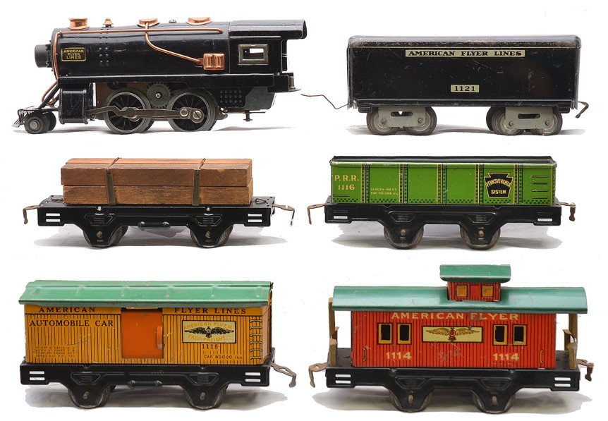 AF Litho Set Loco 1121 1141 1116 1115 1114: American Flyer prewar O gauge lithographed freight set containing; black sheet metal 2-4-0 steam loco, 1121 tender, 1141 black log car with load, 1116 green Pennsylvania sand car, 1115 yellow/orange a