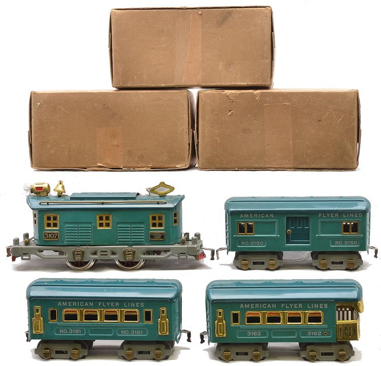AF Blue/Green Pass Set 3107 3150 3161 3162: American Flyer prewar O gauge blue/green passenger set including; 3107 electric loco, 3150 baggage, 3161 coach and a 3162 observation. The loco and cars have brass trim and the cars have gray trucks a