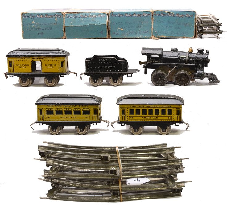 Ives Yellow Litho Pass Set 6 11 50 51 52: Ives prewar O gauge yellow lithographed passenger set containing; no. 6 cast iron black clockwork steam engine, no. 11 N.Y.C. Lines tender, 50 baggage, 51 Chair car, 52 Parlor car, four straight track