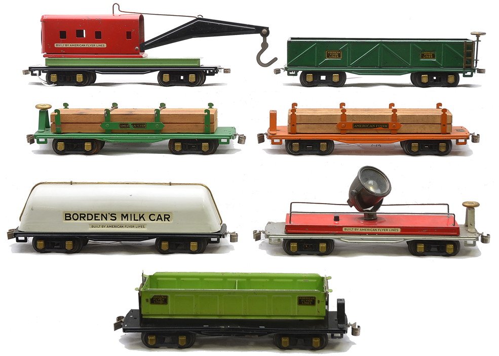 AF Freights 3025 3207 3212 3213 3216 3216 3219: American Flyer prewar O gauge eight-wheel freight cars including; 3025 wrecker car with light green base, red cab and black boom, 3207 green sand car, 3212 Bordons Milk Car, 3213 silver searchlight ca