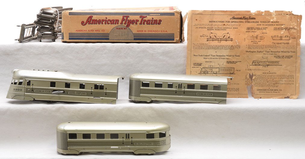 Am Flyer Clockwork Tin Litho Pass Set 562 2-564: American Flyer prewar O clockwork tin lithographed passenger set including; 562 power car, 564 coach, 564 observation, two straight track sections, eight curve track sections and instruction sheet in 