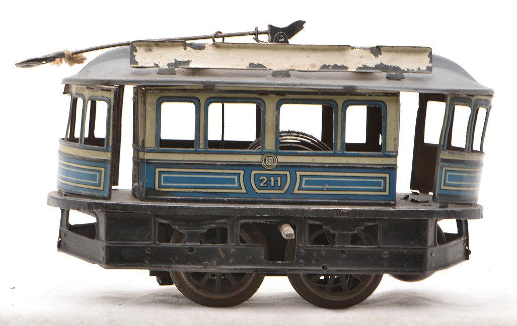 Gunthermann German Tin Clockwork Trolley: Gunthermann prewar German tin lithographed blue and gray clockwork trolley. The trolley is marked SG on the sides which stands for Sam Gunthermann and is numbered 211, C5.