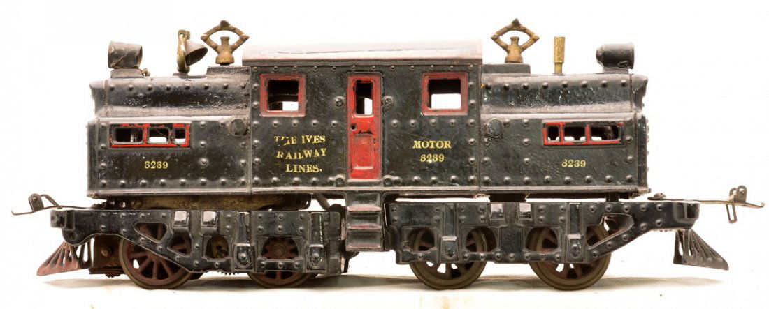 Ives Prewar 1 Gauge 3239 Black Cast Iron Loco: Ives prewar 1 gauge 3239 NYC cast iron electric locomotive silver lettered THE IVES RAILWAY LINES. The loco has a black body, black frame, red painted doors, window frames, steps and ventilators. The