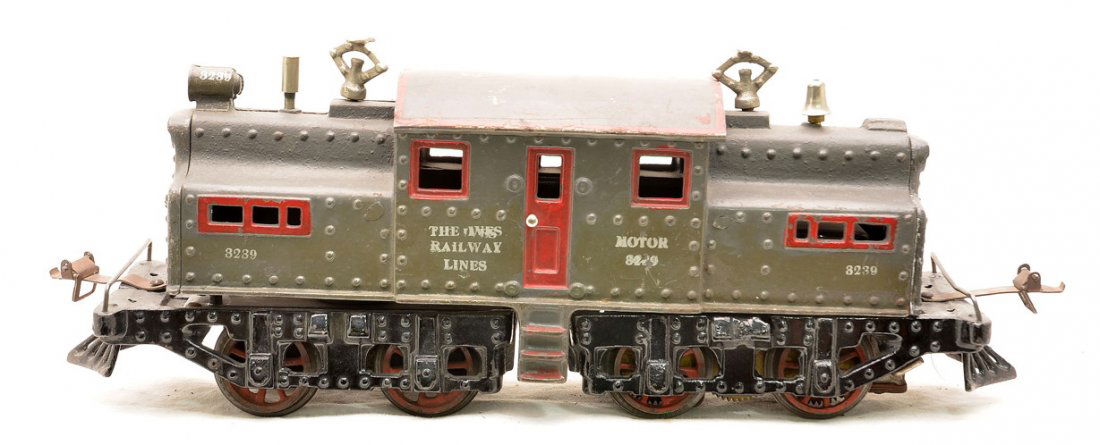 Ives Prewar 1 Gauge Gray 3239 Electric Loco: Ives prewar 1 gauge 3239 NYC cast iron electric locomotive silver lettered THE IVES RAILWAY LINES. The loco has a gray body, black frame, red painted doors, window frames, steps and ventilators. The r
