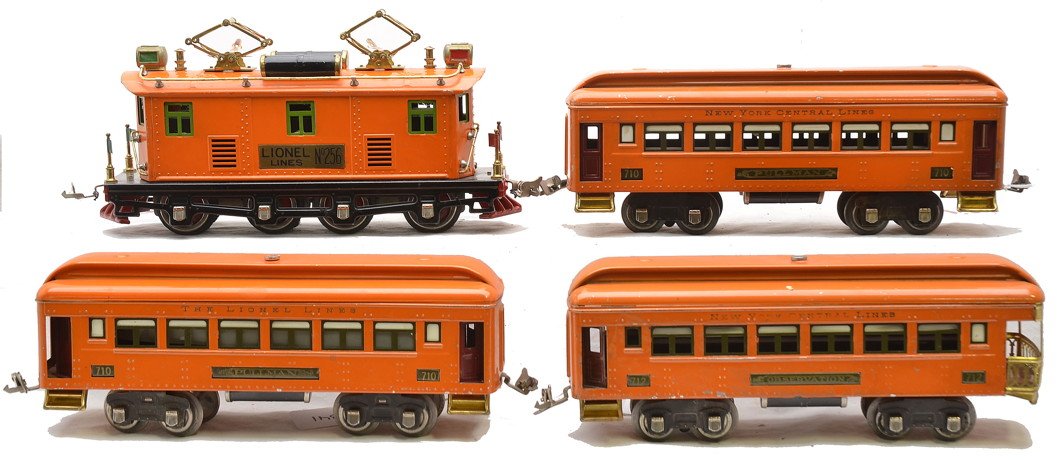 Lionel Prewar O Ga. Orange Pass Set No. 268: Lionel prewar O gauge orange passenger set no. 268 containing; 256 electric loco with black lettered brass plates, two 710 Pullman cars and a 712 observation. The cars have dark olive green inserts, m