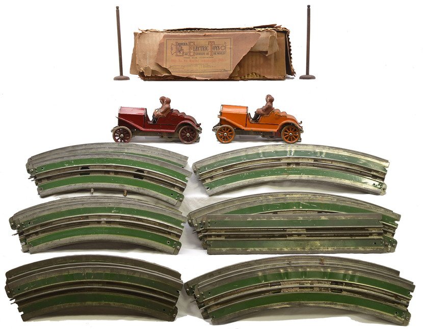 Lionel Prewar 84 Double Racing Auto Set OB: Lionel prewar no. 84 double racing automobile set with a no. 80 and no. 81 orange and maroon race cars both with drivers, two wooden starting posts, eight O curve track sections, one with wiring conne