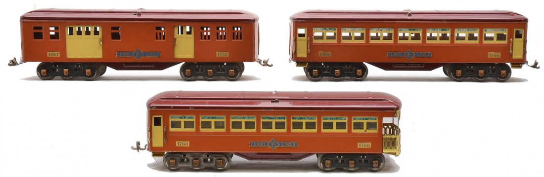 Lionel T.Cotta Passenger Cars 1767 1766 1768: Lionel prewar standard gauge terra cotta passenger cars with maroon roofs, cream inserts and copper journals including; 1767 baggage/mail car, 1766 Pullman and a 1768 observation. The 1766 is missing 