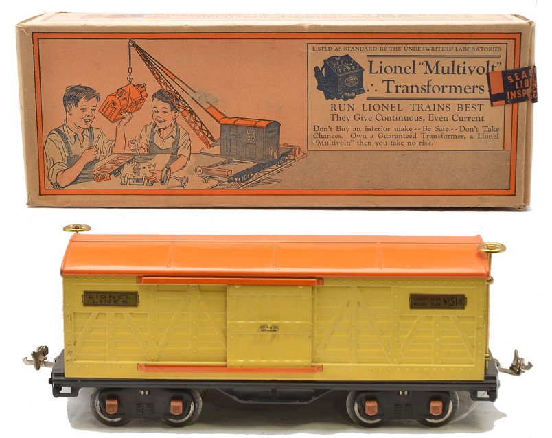 Lionel 514 Cream Boxcar with Orange Roof Boxed: Lionel prewar standard gauge 514 cream boxcar with orange roof and door guides, brass trim and copper journals in OB. Car is C8. OB is square and clean with all flaps attached.