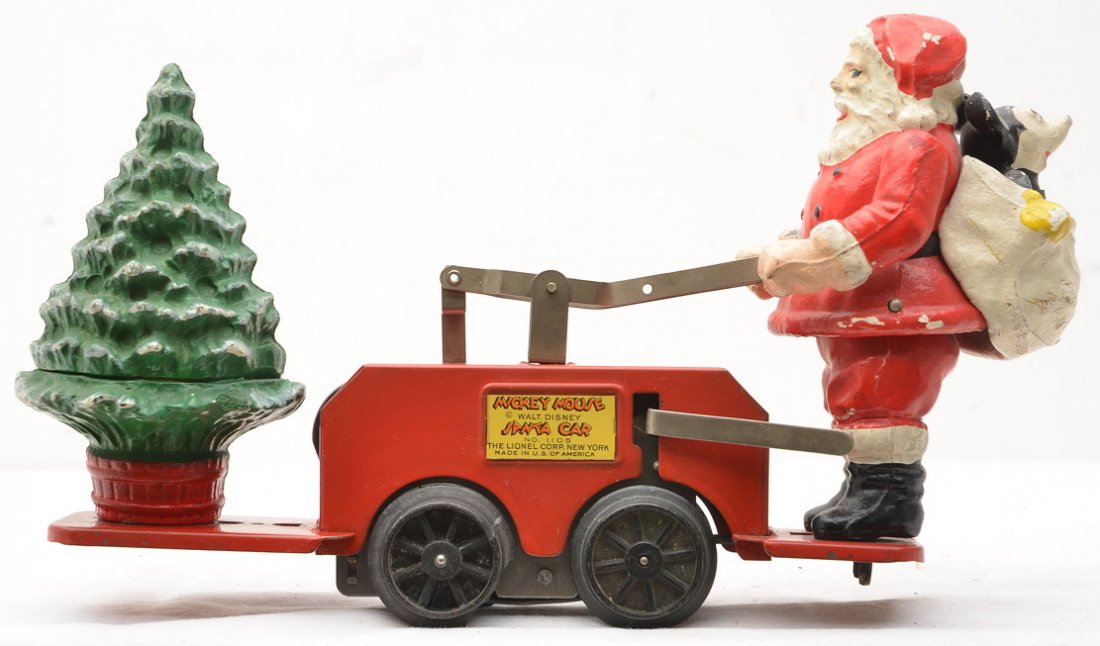 Lionel 1105 Santa with Mickey Mouse Hand Car: Lionel prewar O gauge 1105 Santa with Mickey Mouse wind-up hand car with red base. One hand car wheel is chipped. Hand car is C7.