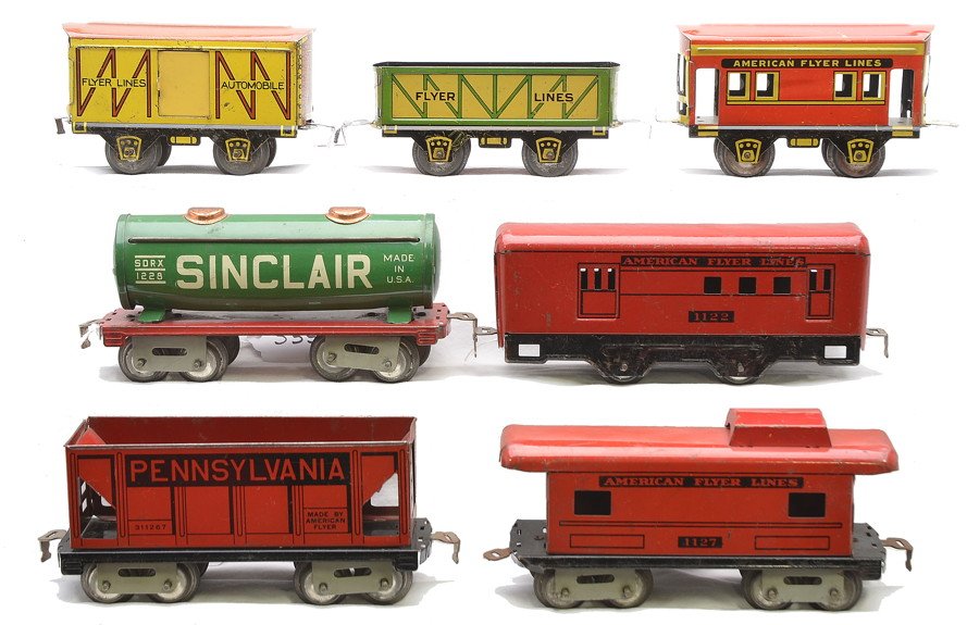 AF Freights 1126 1228 1127 534 1122 515: American Flyer prewar O gauge lithographed freight cars including; 1126 red Pennsylvania hopper, 1228 green Sinclair tank car, 1127 red caboose, hummer style sand car, 536 orange caboose without cupol