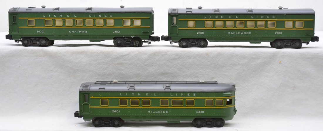 Lionel three Green Pass Cars 2400 2402 2401: Lionel postwar three green passenger cars with gray roofs including; 2400 Maplewood Pullman, 2402 Chatham Pullman and 2401 Hillside observation. The trucks and wheels on all cars are covered with rust