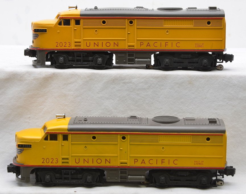 Lionel Yellow/Gray UP 2023 Alco AA Diesels: Lionel postwar yellow and gray 2023 Union Pacific Alco AA diesel units with nose decals intact, C7-8.