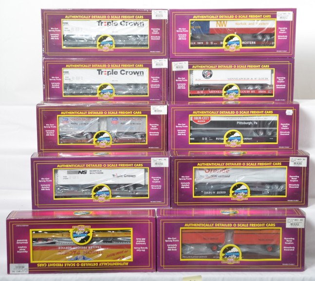 10 MTH flats with trailers, 98116, 98183, 98123, etc: MTH Premier modern O gauge freight cars in OB. Ten flats with trailers include 98130 M&St.L, 98549 Rio Grande, 98107 Union Pacific, 98416 Pittsburgh Brewing, 98123 Norfolk Southern, two 98116 Norfolk