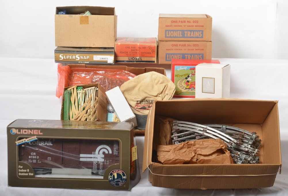 Mixed lot of trains and acc. TCA, Schylling, large: Train odds and ends. Includes 4 TCA 1964 convention cups, Avon Lionel F-3 model, Schylling Mickey Mouse tin hand car, 87802 Lionel Large Scale Conrail boxcar with ETD, St. Louis LRRC REA Express tow t