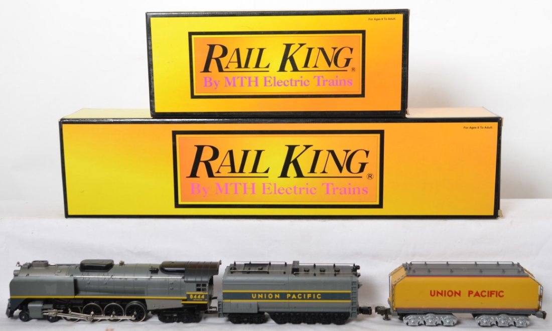 Railking Union Pacific FEF Northern with Proto and Aux: MTH Railking modern O gauge Union Pacific FEF Northern in OB. Catalog number is 30-1151-1. Loco features smoke, Protosounds, and more. Locomotive has also been upgraded with a BCR battery for the onbo