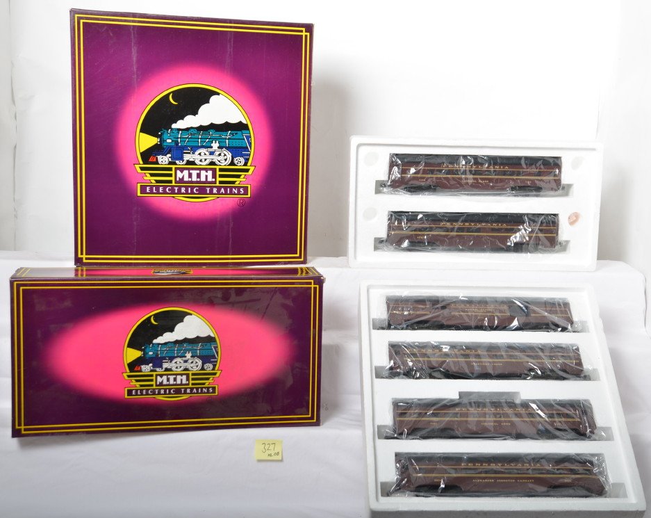 MTH Pennsylvania 6 car aluminum passenger set: MTH modern O gauge Pennsylvania painted aluminum passenger cars; MT-6017 four-car set and MT-6117 sleeper/diner set in OBs. Cars are C8 with run time. OBs have some corner and edge wear.