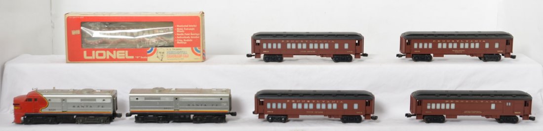 Lionel Santa Fe Alcos and Pennsylvania passenger cars: Lionel modern O gauge locos and passenger cars. Includes Santa Fe 8020 and 8021 Alco A-B set and the following Pennsylvania passenger cars 9614, 9510, 9515, 9513, and 9528 in OB. Trains are C6-7.