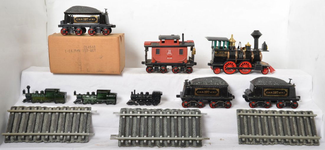 Empty Jim Beam train decanters and Avon train bottles: Jim Beam Whiskey and Avon empty bottles. Includes five empty Jim Beam train decanters and three Avon bottles. Also included is four sections of original Jim Beam track.