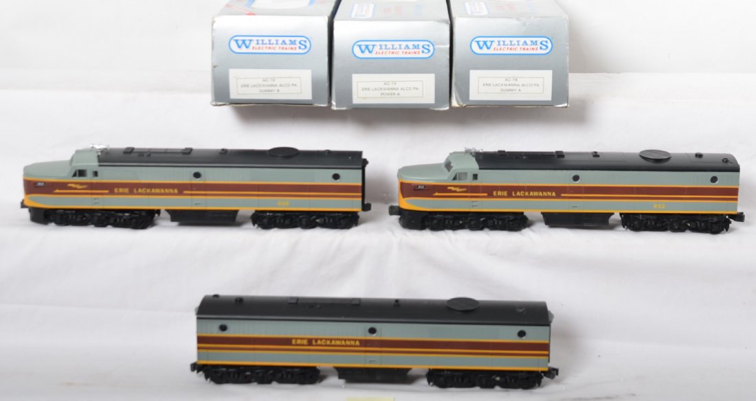 Williams Erie Lackawanna Alco PA A-B-A: Williams modern O gauge Erie Lackawanna Alco PA A-B-A in OBs. Locos are C7 condition with some light scuffs and wear. OBs have moderate corner and edge wear. Catalog numbers are AC-15, 16 and 19.