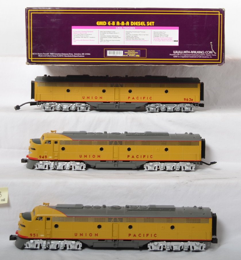 MTH Union Pacific E-8 with Proto: MTH modern O gauge 20-2208-1 Union Pacific E-8 A-B-A set in OB. Powered loco features Protosound, Protosmoke, Protocouplers, and more. Trains are C8 with run time and some shelf dust. OBs have some sh