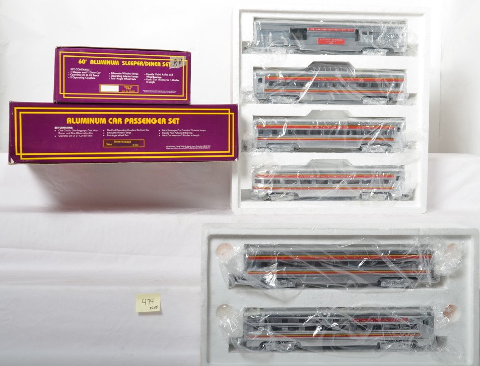 MTH Santa Fe aluminum 7 car passenger set: MTH modern O gauge Union Pacific seven car passenger set in OBs. Includes 20-6021 five car set and 20-6121 diner / sleeper add on. Cars are C8 with run time. OBs have some light corner wear.