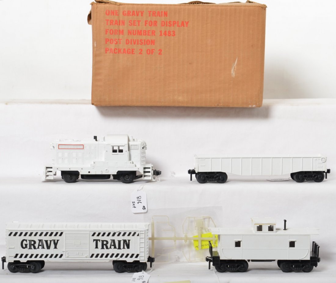 Kusan 1483 Gravy Train diesel freight set in OB: Postwar Kusan O gauge No. 1483 battery operated Gravy Train diesel switcher freight set in original box with dividers. Set look C8-9 area with loco trim on sprue. Box has a tiny bit of very light wear