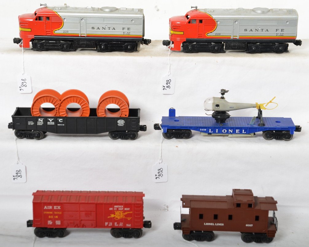 Lionel 220P/T, 6062, 3419, 6014, 6017 Alco diesel: Postwar Lionel O gauge 220P and 220T Santa Fe Alco diesel A units with 6062 NYC canister car w/canisters, 3419 helicopter launching car (original copter missing a rotor blade), 6014 Airex boxcar, 6017