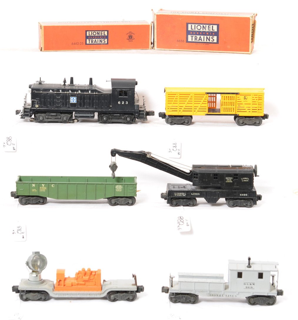 Lionel 623 NW-2, 3520, 6460, 6656, 6462, 2419 freight: Postwar Lionel O gauge 623 A.T.S.F. NW-2 diesel switcher, 3520 searchlight car, 6460 operating work crane, 6656 stock car, 6462-25 New York Central gondola, and 2419 D.L.&W. work caboose. Trains shoul