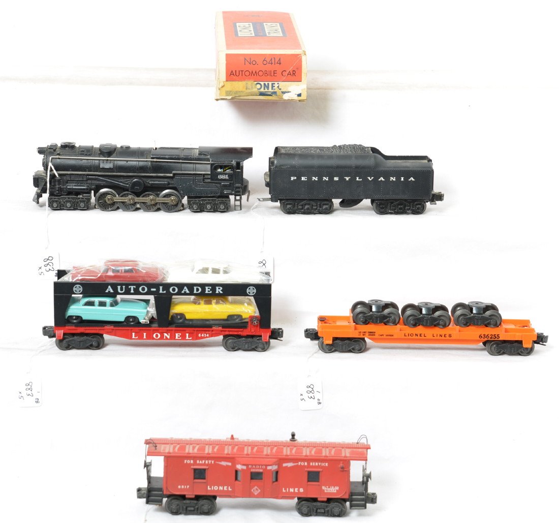 Lionel 681/2671W, 6414 in OB, 6362, 6517 steam freight: Postwar Lionel O gauge 681 steam locomotive/2671W Pennsylvania whistle tender, 6414 Evans Auto-Loader w/repro autos, 6362 rail truck car, and 6517 bay window caboose, C6. Caboose has one cracked hand