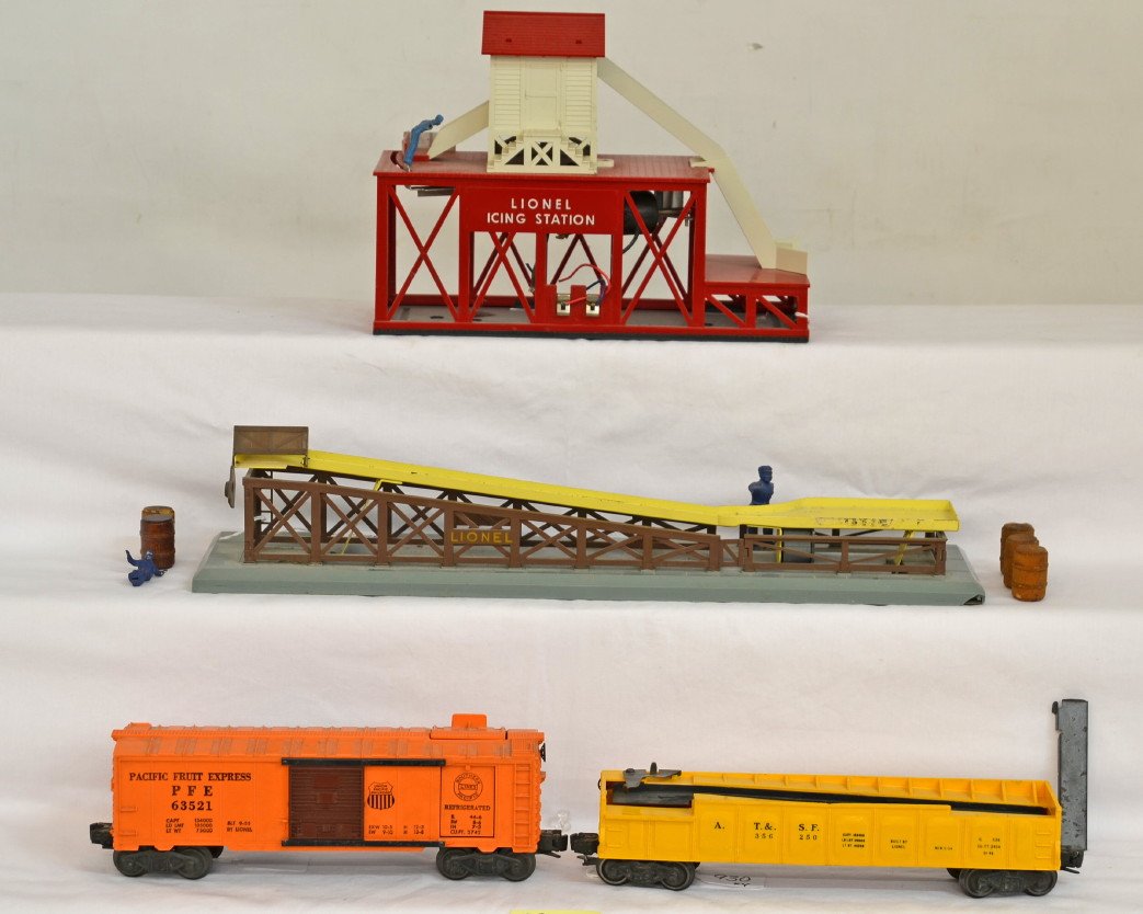 Lionel 352 ice depot and 362 barrel loader, w/cars: Postwar Lionel O gauge operating accessories with cars, 352 ice depot with 6352 PFE ice car, and 362 barrel loader w/3562-50 ATSF barrel car. Items look C6. Ice depot worker has missing arms and broom