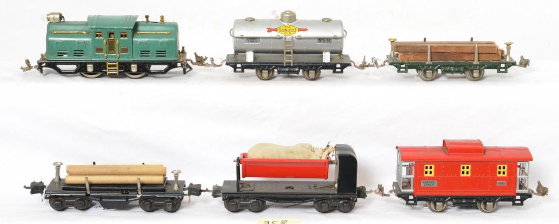 Lionel 252 electric, 804, 831, 3651, 3659, 807 freight: Prewar Lionel O gauge 252 center cab electric loco, 804 Sunoco tank, 831 lumber car, 3659 automatic log car, 3659 automatic dump car, and 807 caboose. Trains should clean to look C6.