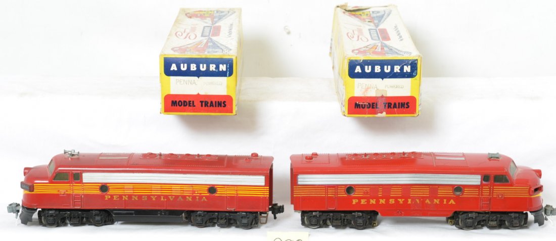 AMT Pennsylvania F3a diesel locomotives in OB powered: Postwar Auburn Model Trains AMT O gauge F3a diesel locomotives, both appear to be powered units. One unit is missing mounting screws. Trains should clean and refurbish to look stronger C6 area. One bo
