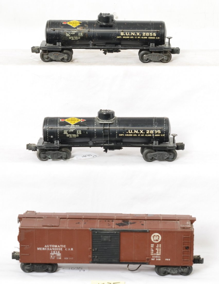 Lionel 2855, X3854, and 2855 freight cars: Postwar Lionel O gauge freight cars, two 2855 Sunoco tanks and 3854 Pennsylvania automatic merchandise car, C6.