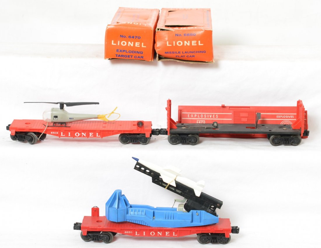 Lionel 6650, 6819, 6470 space and military freight w/2: Postwar Lionel O gauge 6650 missile launching flatcar, 6819 flatcar w/helicopter (original Navy copter), and 6470 exploding target car. Trains look C6-7. Boxes have missing flaps, tears, etc. Boxes ar