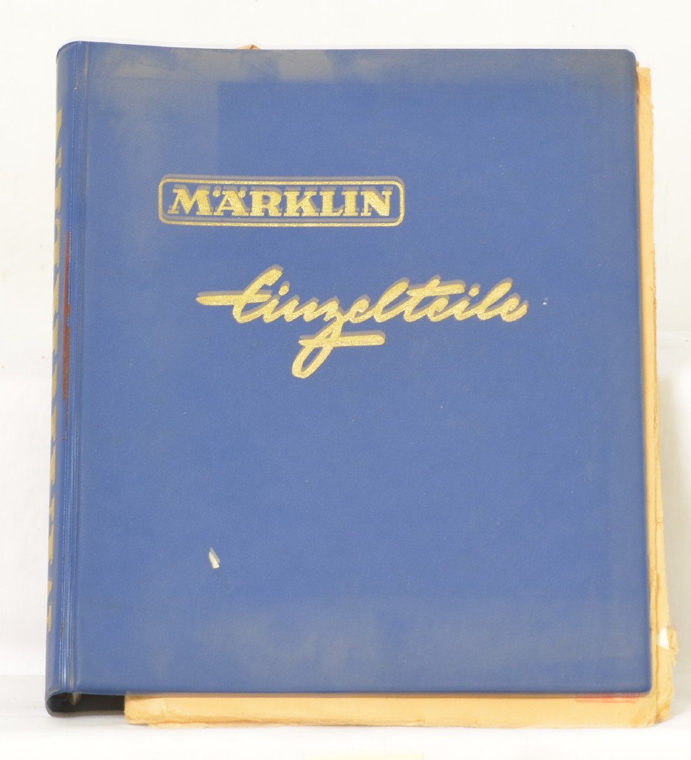 Marklin 1964 service binder and sheets: Marklin dealer service binder and sheets from 1964. Blue binder has some very light wear, but sheets and tabs are in nice clean condition. Also included with the binder are four mailers with additiona