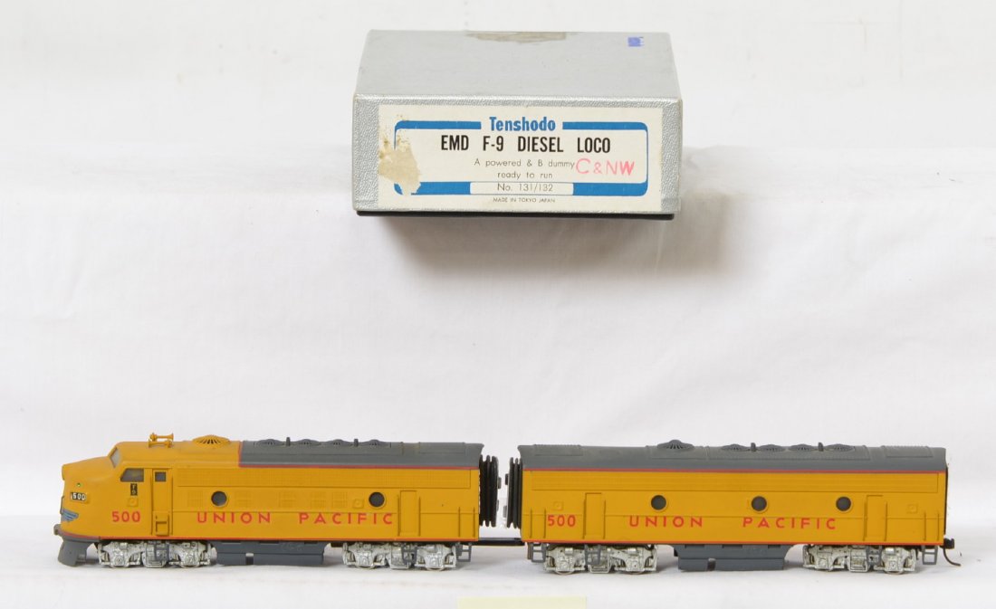 Tenshodo Union Pacific F-9 A-B set: Tenshodo brass HO EMD F-9 A-B diesel locomotive set. No. 131/132 repainted into Union Pacific colors. C8 with some shelf dust. OB has some light wear.
