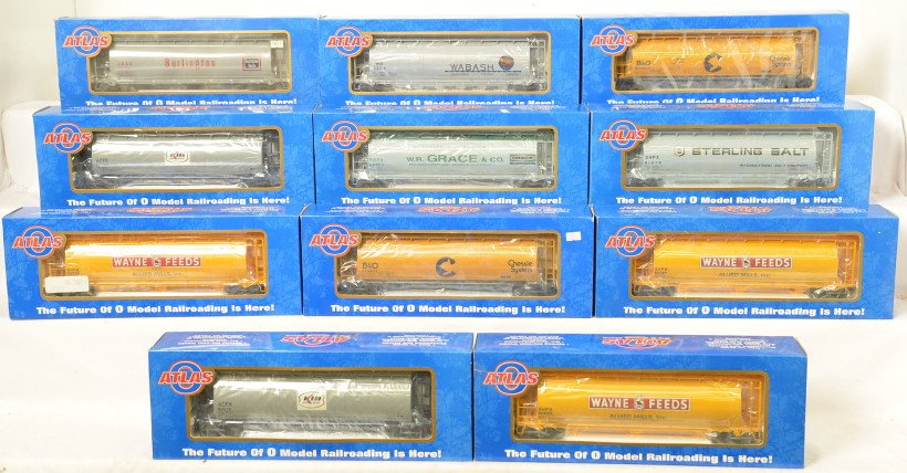 11 Atlas O cylindrical hoppers Wayne Feeds, Kerr, etc: Atlas modern O gauge cylindrical hoppers in OBs. Eleven hoppers include 6309-1 Sterling Salt, 6301-1 Burlington, 6305-3,-1, and -4 Wayne Feeds, 6306-4 W.R. Grace, 6307-1 and -2 Kerr McGee, 6336-1 Waba