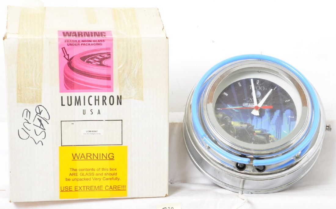 Tough Lionel Century Club neon clock: Tough to find Lionel modern Century Club neon clock with OB. Clock has a few minor issues, there is some spotting on the chrome, two inch dent in one edge, and the neon hums but does not light. Clock 