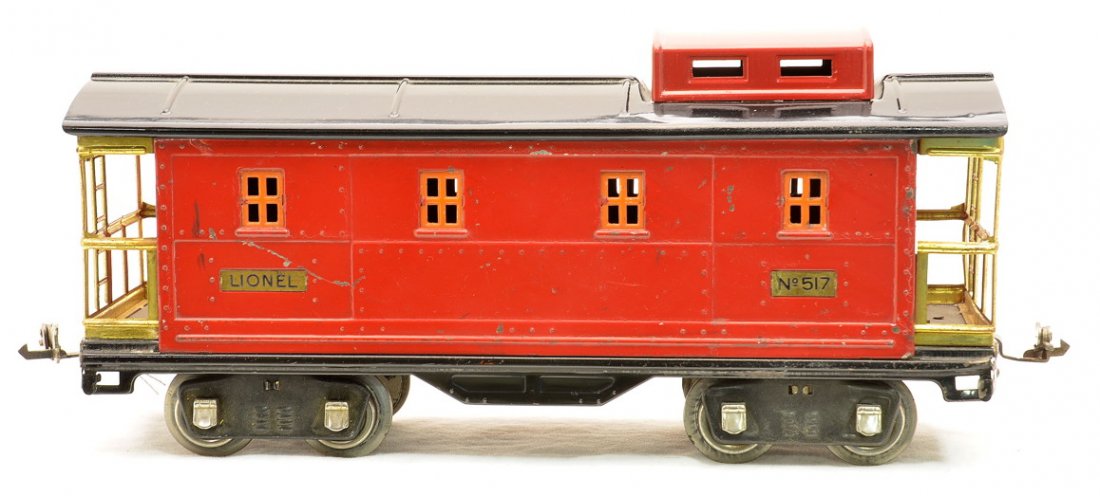 Lionel 517 Red Caboose from 340E Coal Train Set: Lionel prewar standard gauge 517 red caboose with black roof, orange windows, brass trim and nickel journals from the 340E Coal Train freight set, circa 1929. The roof has been restored and the caboos