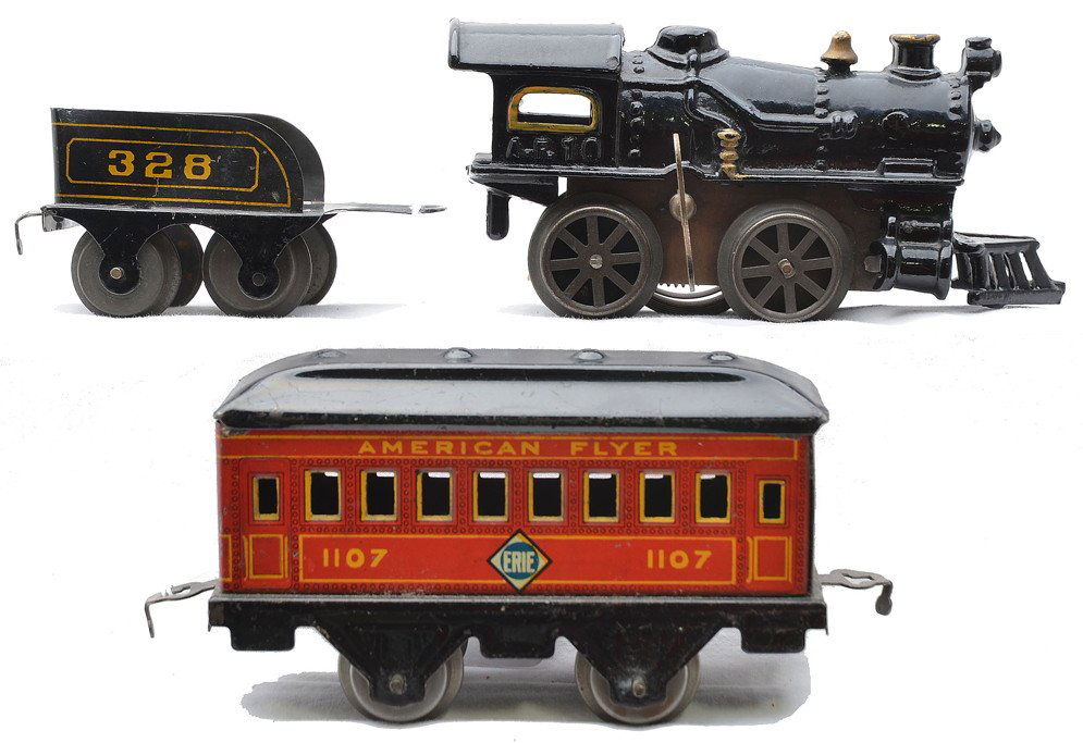 AF Set No. 0 with No. 10 Loco 328 Tender 1107: American Flyer prewar O gauge passenger set, circa 1925-1926 which consist of a No. 10 clockwork 0-4-0 cast iron black locomotive, 328 black and gold tender and 1107 Erie 5 1/2 inch passenger car. The