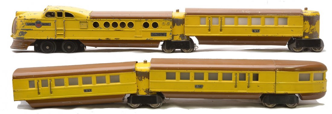 Lionel Yel/Br. UP Streamliner Pass Set no. 299W: Lionel prewar O gauge yellow and brown Union Pacific streamliner passenger set no. 299W including; 636W power car, two 637 coaches, 638 observation and three vestibules. Set is C5.