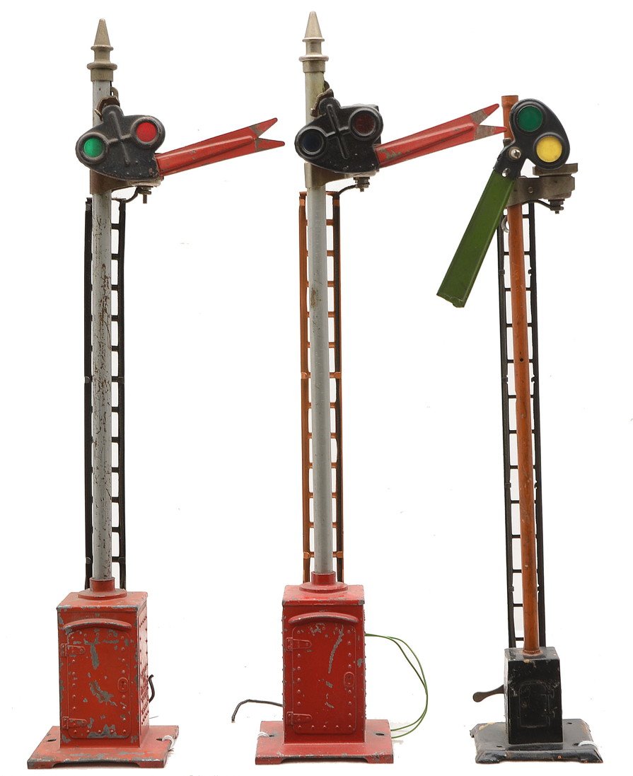 Lionel Prewar Std. Ga. 80 80 65 Semaphores: Lionel prewar standard gauge two 80 semaphores both with red bases, aluminum poles and nickel finials. One semaphore has an orange ladder and the other one has a black ladder. Also included is a 65 se