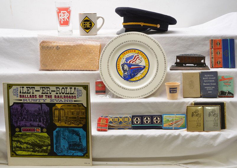 Railroad Conductors Hat Matches Cards Envelopes: Selection of miscellaneous Railroad items including; Amtrak conductors hat, American Freedom Train plate, Erie Lackawanna envelopes, matches, playing cards, Erie mug, PRR glass and record. Please view