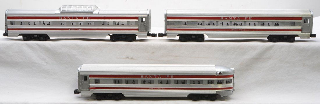 Lionel 3-Aluminum SF Pass Cars 2563 2562 2561: Lionel postwar three aluminum Santa Fe red stripe passenger cars including; 2563 Indian Falls Pullman, 2562 Regal Pass vista dome and a 2561 Vista Valley observation. Cars are C7-8.