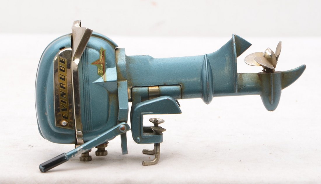 K & O Evinrude Batter Operated Toy Outboard Motor: Japanese K & O Evinrude battery operated twin toy outboard motor. One blade is bent and the silver framing is also bent on one corner.