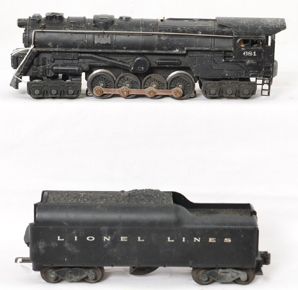 Lionel 681 Turbine and 2046W whistle tender: Postwar Lionel O gauge 681 Steam Turbine locomotive with 2046W whistle tender. Trains may or may not clean C6 area. Trains are sold as they are shown in our photos with NO returns.