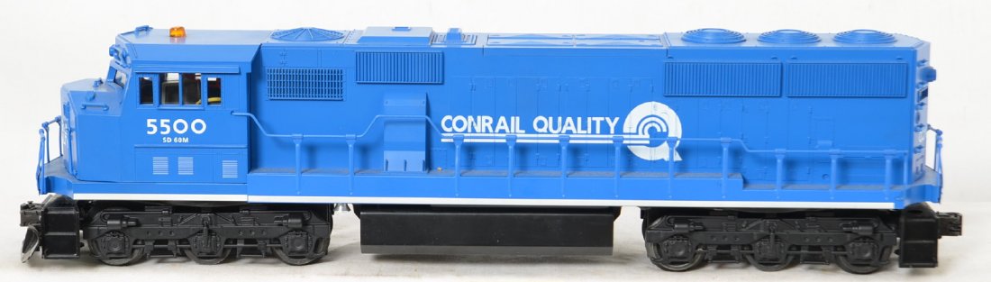 Lionel 18216 Conrail SD-60M Diesel: Lionel modern O Gauge Conrail 18216 SD60M diesel locomotive. Loco features Railsounds, operating headlights and ditch lights, dual motors and more. Loco is C7 missing the horn and with light mildew on