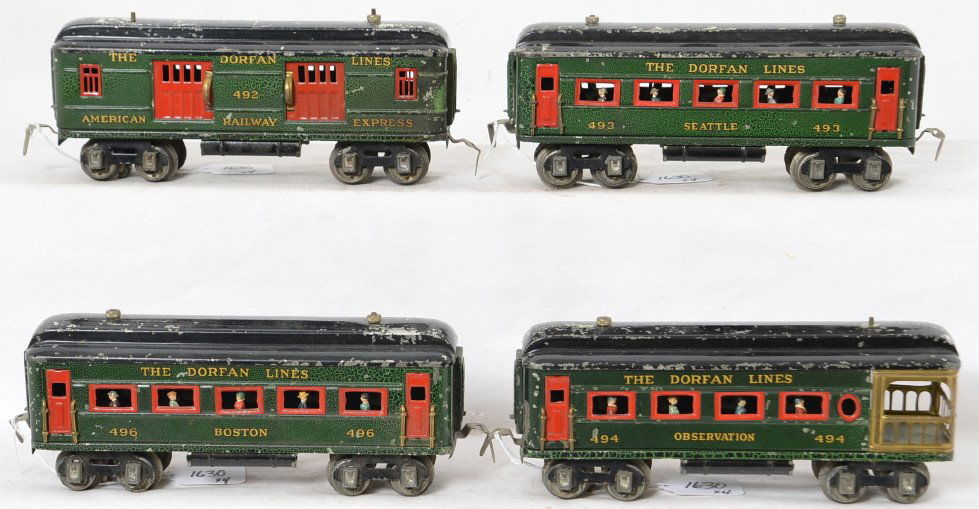 Dorfan Lines 492, 493, 494, 496 passenger cars: Prewar Dorfan O gauge passenger cars, 492 American Railway Express, 493 Seattle coach, 494 observation, and 496 Boston coach. Trains look C6. One coupler is broken on one side of slot. Wheels have var